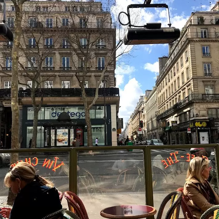 Café en terrasse, on the Haussmanian boulevards, on a sunny day : the simplest and deepest pleasure for a parisian.